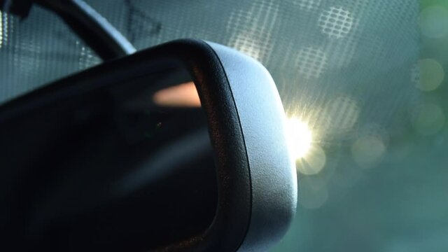 Close Up shot of rear view mirror with sunflair in Ford Mustang Muscle Car Driving, Sunshine 
