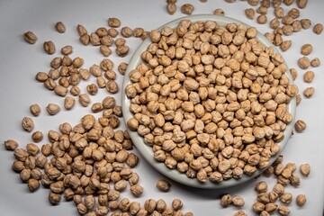 chickpeas from legume family in plate isolated on white background