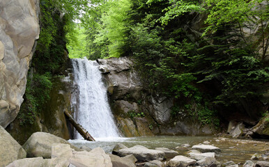 The landscape of Pruncea waterfall and the Casoca river in the Buzau mountains, Romania. A beautiful cascade in the forest © Vali