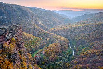 Amazing view from Tumba vantage point on a canyon with meandering river Temstica, autumn colored trees and a rocky summit