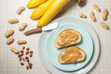 Two slice of peanut butter sandwich on a plate