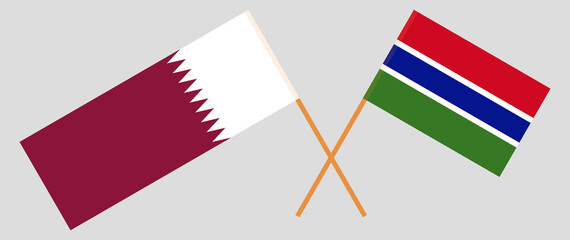 Crossed flags of the Gambia and Qatar