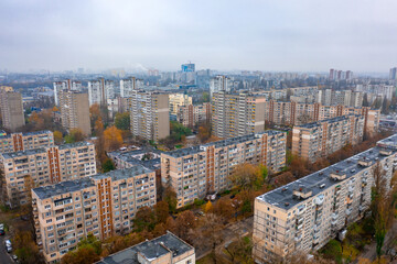 Dormitory district (bedroom community) of the Soviet architecture on a autumn foggy day. Residential apartment buildings (block of flats) of the Soviet period. Aerial view