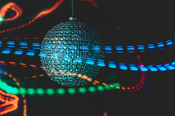 Close up Christmas ornament with long exposure colourful light effects OR Disco Ball