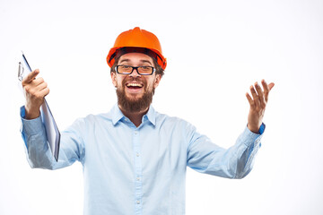 Cheerful man in orange hard hat construction documents service professionals