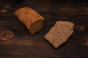 Natural unleavened homemade bread on a wooden background cut into slices