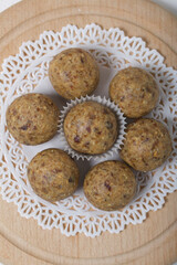Dried fruit and oatmeal sweets. On a white napkin. Close-up shot.