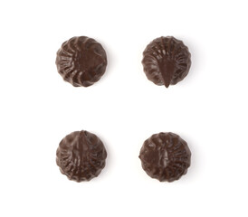 Chocolate-covered marshmallows are laid out on a white background. The view from the top. The concept of desserts.