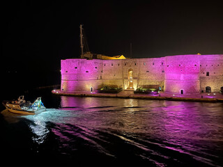 Aragonese Castle (officially called the Castel Sant'Angelo) at night in Taranto, Puglia, Italy