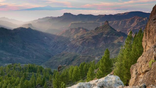 Nature of Gran Canaria island. Sunset view from Roque Nublo point. Tenerife island visible in the background. Canary, Spain