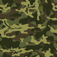 Naklejka premium Green camouflage military pattern seamless background on textiles