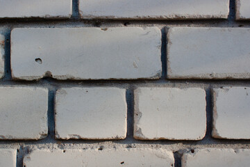 A detailed view of white brick wal