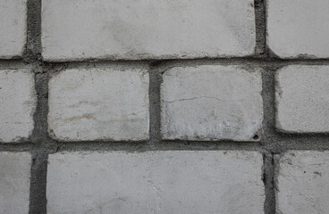 A detailed view of white brick wal