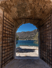 Leper's gate among the ruins of the venetian fortress on the island of Spinalonga, Gulf of Elounda, Lasithi, Crete, Greece. It was used as a leper colony from 1903 to 1957