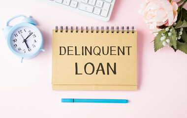 Delinquent loan is shown on the conceptual business photo.