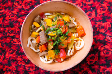 Typical kyrgyz food, with noodles, vegetables and meat, called Laghman