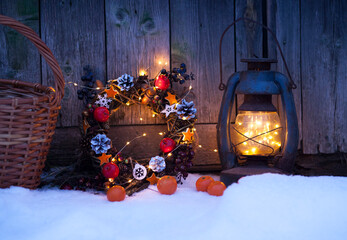 christmas and new year background with christmas wreath and lantern with lights