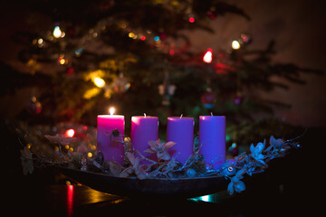 1st advent advent candle burning  in pink color