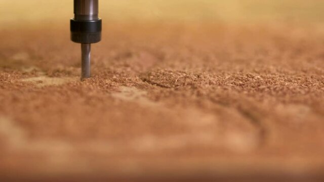 The head cnc of the wooden router cuts out the part according to the programmed route. Close up