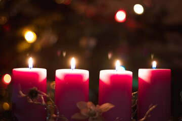 Advent candles concept with burning candles