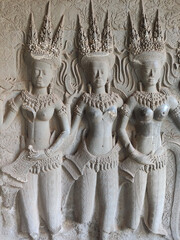 Sculptures of Apsara dancers on the temple wall in Angkor Wat temple. Khmer temple. Unesco World Heritage Site. Siem Reap Province. Cambodia. South-East Asia