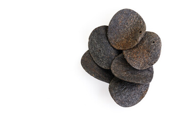 Black potato chips isolated on white background. Close up. There is some free space for your text or sign.