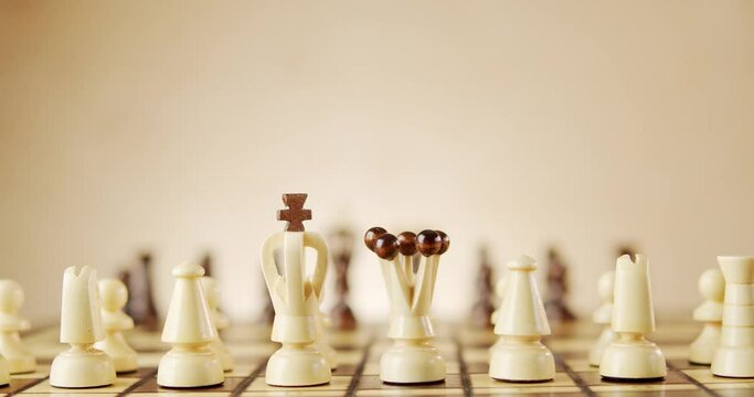 rotating old wooden chess pieces on a chessboard