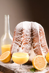 Limoncello with a glass on the table and a soft star-shaped pasta sprinkled with icing sugar....