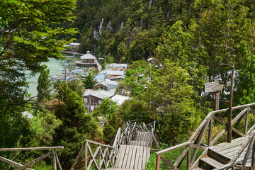 Fototapeta premium wooden piers and walkways of lumber town Caleta Tortel at Rio Baker along the Carretera Austral in Patagonia, Chile, South America