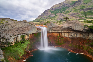long exposure of Salto del Agrio in Patagonia, Argentina, South America with its characteristic red...