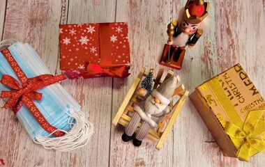 christmas decoration and medical masks on wood table