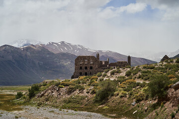 Fototapeta na wymiar Old abandoned ruins of Hotel at the Termas del Sosneado in the andean Mountains of Argentina, South America. 