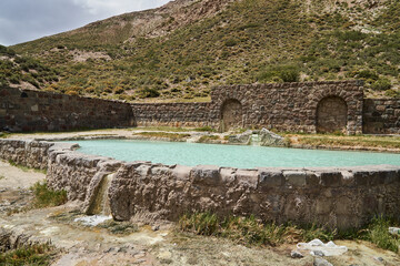 Old abandoned ruins of Hotel at the Termas del Sosneado in the andean Mountains of Argentina, South...