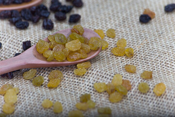wooden spoon with christmas ingredients. rustic wooden table