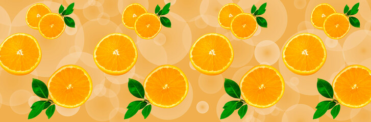 Sliced orange on a bright orange background. Oranges in the panoramic image. Panorama, a banner with space for text or insertion. Pieces of citrus fruit.