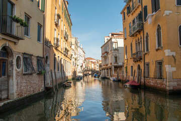 Fototapeta na wymiar City of Venice with its characteristic landscapes with canals, bridges and alleys.