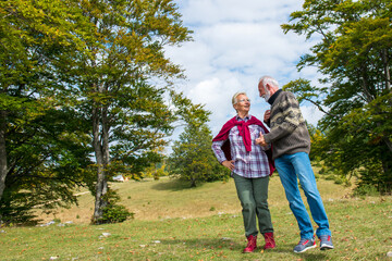 Fototapeta premium Senior couple walking in a beautiful nature