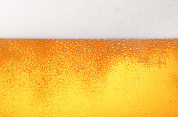 Close up background of beer with bubbles in glass