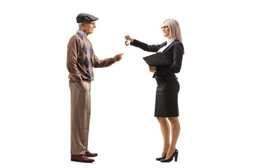Obraz premium Full length profile shot of a professional woman giving car keys to an elderly man