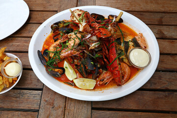 Grilled seafood platter on wooden table