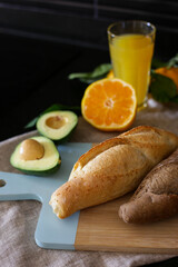 avocado, fresh baked goods and orange juice