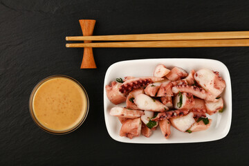 Seafood octopus arm slices salad with satay sauce © breakingthewalls