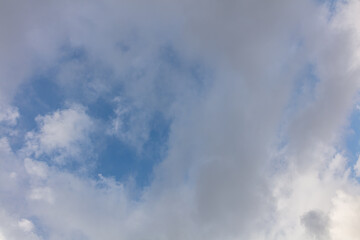 Blue sky with a white and grey cloud