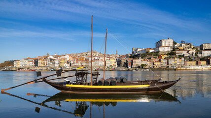 Oporto, Portugal - Porto old town cityscape- Rabelo boat in Douro river.