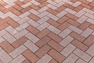 Vintage brown cobblestone pavement pattern and background