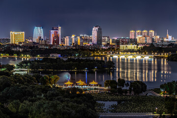 Fototapeta premium Night view of Changchun City and Nanhu Park in China