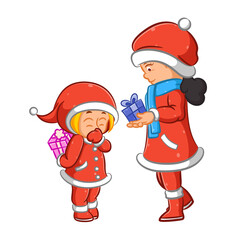 The mother giving the gift for her daughter for the Christmas day
