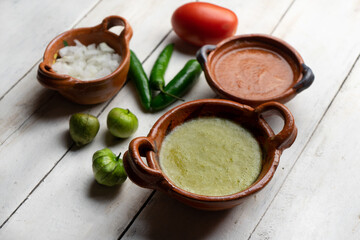 Mexican red and green sauce on white background