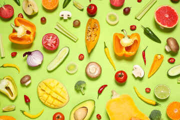 Flat lay composition with fresh organic fruits and vegetables on light green background