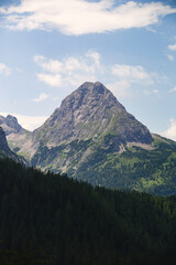 Picturesque mountain landscapes in summer, inviting for hiking with views of the highest peaks of the Alps. Mountain sports enthusiasts and hikers immediately have wanderlust